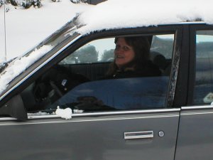 [Mom trying to get the car out of the snow]